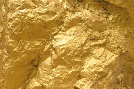 Gold paint stone or rock texture glitter abstract on background.の写真素材