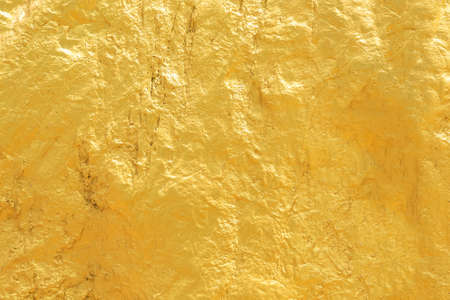 Gold paint stone or rock texture glitter abstract on background.の写真素材