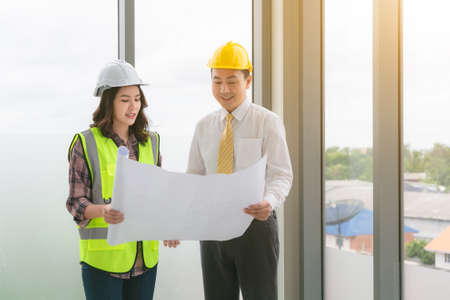 Two business construction site engineer. Engineering objects on workplace with partners on...