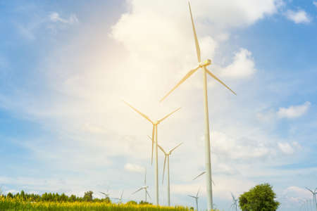 Wind mill generators under blue sky on sunset. Solar energyの写真素材