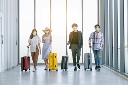 Young people group in Airport Lounge waiting departure and happy smile at airport.の写真素材