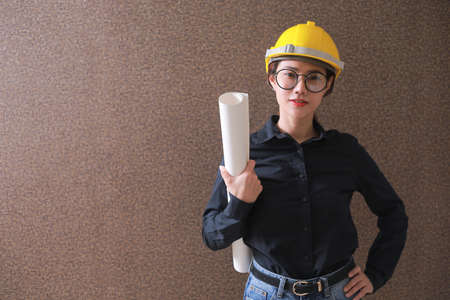 Business Asia woman engineer developer holding blueprint working Confident.の写真素材