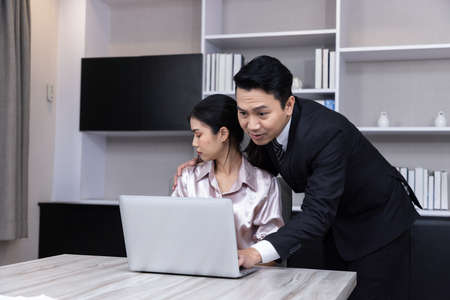 Welcome to our team of young modern men in smart casual wear shaking hands while working in the creative office.の写真素材