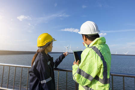 Young female engineer smiling and holding harthat looking to the future.の写真素材