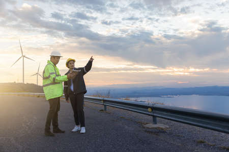 Engineers analysis windmill engineers inspection and progress check wind turbine.