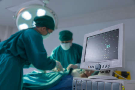 Electrocardiogram display in hospital surgery operating emergency room showing patient heart rate.の写真素材