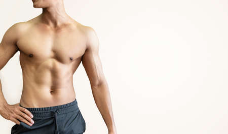 Handsome muscular man posing and flexing muscles.の写真素材