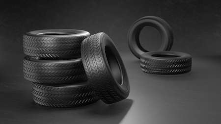 New car tires pile on the asphalt on a black background. 3D illustrationの写真素材