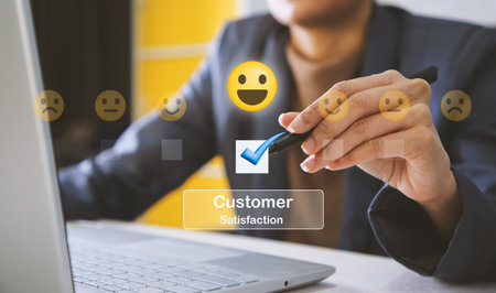 Close up of man hand pressing on smartphone screen with customer positive think, smile mental review. Customer satisfaction conceptの写真素材