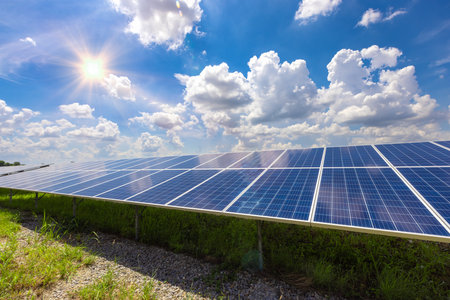 Solar power station with solar panels for producing electric power energy by green power.の写真素材