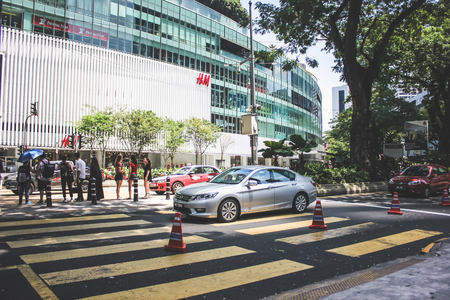 Kuala Lumpur, Malaysia - October 21, 2017: View of tourist crossing the zebra crossing to Avenue K Shopping Mall in Kuala Lumpur, Malaysiaのeditorial素材