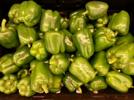 Pile of fresh organic green bell pepper capsicum at vegetables marketの素材