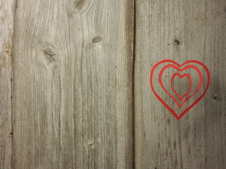 Valentine card - hearts on rough wooden backgroundの写真素材