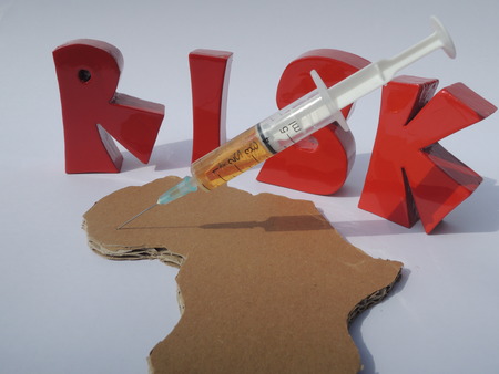 3D letters "Risk", Africa, and medicine for illustrating the risk of using untested medicine in West Africaの写真素材