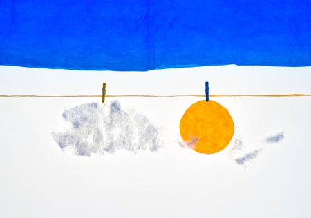 composition with clothes pegs and a fake sun and skyの写真素材