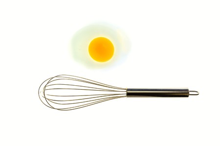 Metal whisk and eggs for a minimalist compositionの写真素材