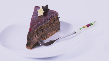 Chocolate cake with strawberry sauceの写真素材