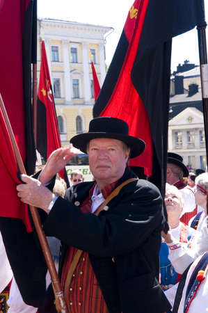 June 20, 2010. Helsinki, Finland. A man wearing traditional clothes and a hat representing his region during a Festival of National Culture.のeditorial素材