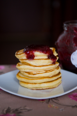 A pile of pancakes on a plate.の写真素材