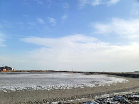 Dry mudflat sea at low tide