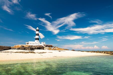 Mudouyu Lighthouse, black and white lighthouse with clean ocean.の写真素材