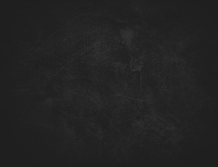 Black abstract background with spots and scratchesの写真素材