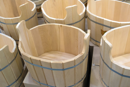 A number of wooden handmade bath basins at the market, may be used as backgroundの写真素材