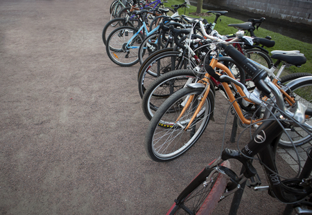 New Holland island, Saint-Petersburg, Russia, May 26, 2018. Visitors bicycles left at the entrance to the island territoryのeditorial素材