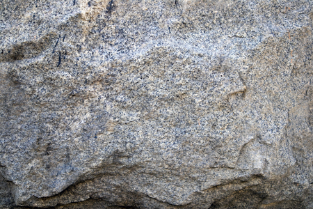 Gray natural stone texture, relief granite surface, may be used as backgroundの写真素材