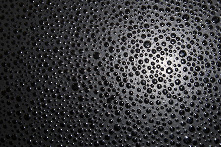 Dark plastic surface with a lot of frozenの写真素材