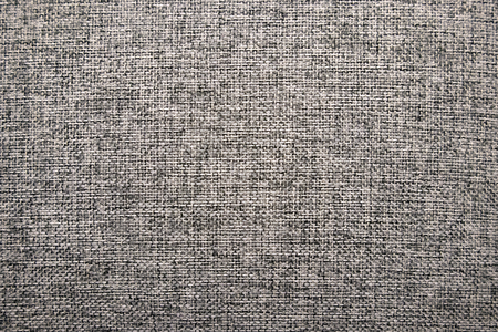 Gray textile interlaced pattern closeup, may be used as background or textureの写真素材