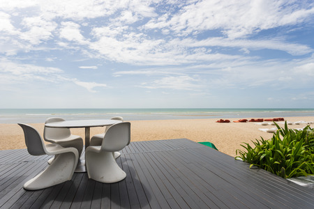Table set with beach and sea.の写真素材