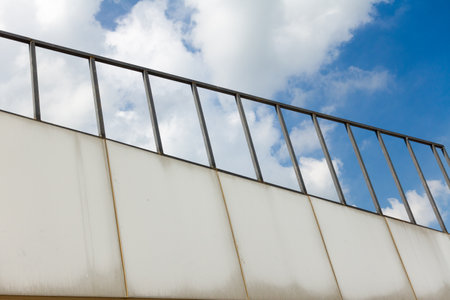 A shot of metal bars building and clear blue skyの写真素材