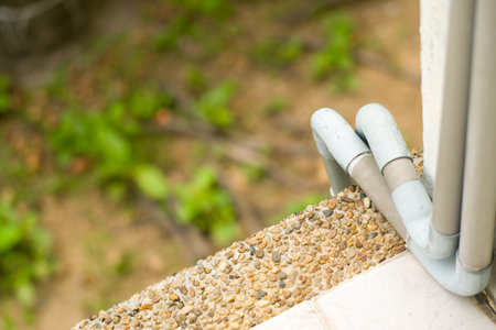 Pebbles and faucet in the garden, stock photoの写真素材