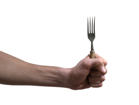 Fork in hand isolated on white backgroundの写真素材