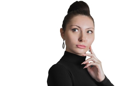 Portrait of young woman thinking about somethng important isolated on whiteの写真素材