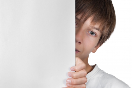 Smart boy with sheet of paper isolated on whiteの写真素材