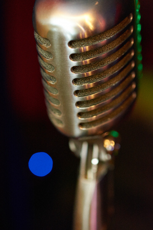 Stylish retro microphone on a colored backgroundの写真素材
