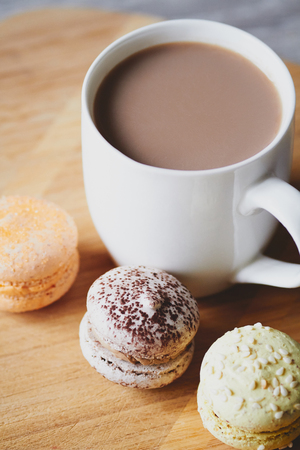 Macaroons and cocoa on the wooden tableの写真素材