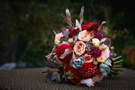 Colorful wedding bouquet on blurred green backgroundの写真素材