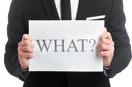 Photo of tablet with question what in man's handsの写真素材