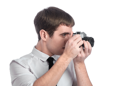 Photograph with retro camera in his handsの写真素材