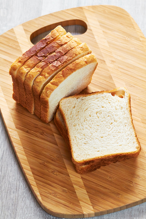 Slices of bread for toasting on a cutting board