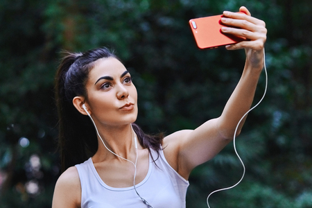 Young girl is taking selfieの写真素材