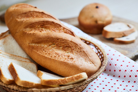 fresh white loaf of bread and cupcakes