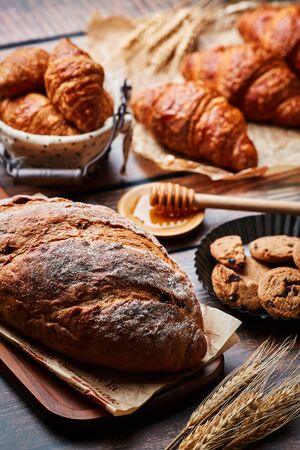 Miscellaneous delicious pastry on the wooden tableの写真素材