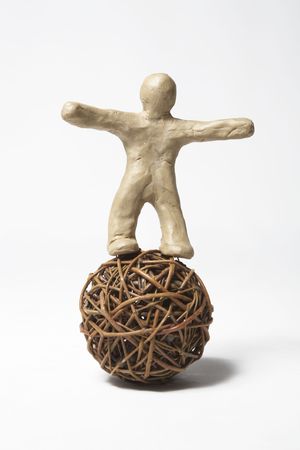 The plasticine person does exercises with a sphereの写真素材