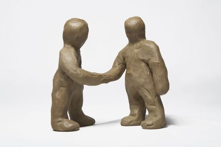 Two plasticine persons welcome each other hand shakeの写真素材