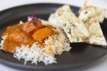 An Indian food dish of tikka masala and basmati rice.