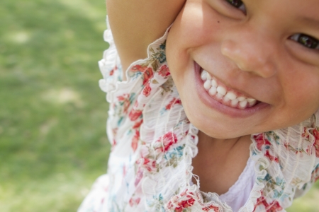 A young girl enjoys the afternoon with her family.の写真素材